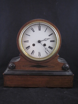 A 19th Century French 8 day striking mantel clock with  enamelled dial and Roman numerals, contained in a walnut and  ebonised case 11"