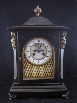 A French 19th Century 8 day striking bracket clock with  enamelled dial, Roman numerals and visible escapement by H Marc of Paris, contained in an ebony and gilt metal case 10"   ILLUSTRATED