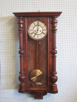 A Vienna style striking regulator with 7 1/2" dial and subsidiary second hand, contained in a walnut case
