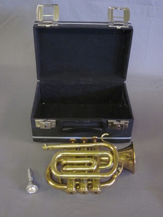 A brass pocket cornet marked Boosey