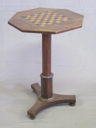 A 19th Century octagonal inlaid rosewood games table, the top  inlaid a chessboard and raised on a chamfered column with triform base 20"