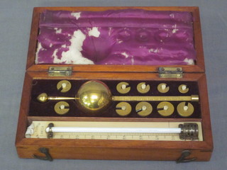 A Sikes hydrometer, missing magnifying glass, contained in a rectangular mahogany box with hinged lid