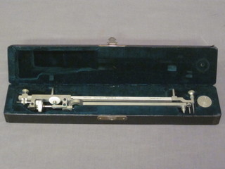 A polished steel mapping device, cased