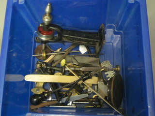 A small iron anvil, a watch maker's lathe and various precision  tools