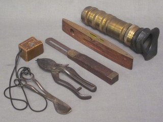 A section of brass telescope, a pair of 19th Century secateurs by  Skelton, a pair of wick trimming scissors, a light meter, a  mahogany and brass spirit level by J Rabone & Sons no.1625 and  a brass gauge