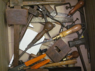 2 wooden mallets, an oil stone and various tools