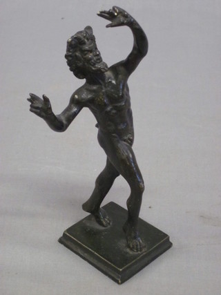 A bronze figure of a walking faun, raised on a square base 5"