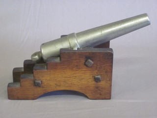 A steel model cannon with 10" barrel marked 1805, raised on a wooden trunion, the barrel reads With respect to Captain Hardy  1805,  ILLUSTRATED