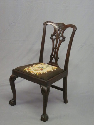 A 19th Century mahogany Chippendale style slat back dining  chair with upholstered drop in seat, raised on cabriole ball and  claw supports