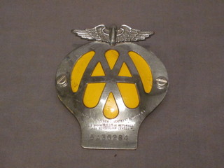 An AA beehive car badge and 2 AA keys