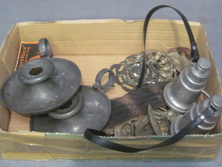 A pair of pewter chamber sticks, a pewter flask in the form of a  pair of binoculars, an HMV Instantaneous speed tester and a  collection of horse brasses