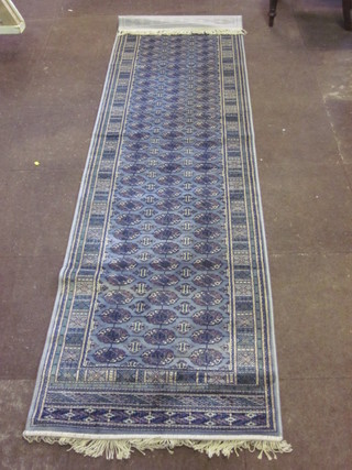A contemporary blue ground Bokhara style Belgian cotton runner 108" x 30"