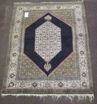 A fine quality black and green ground silk Persian carpet with lozenge shaped medallion to the centre, 65" x 42"
