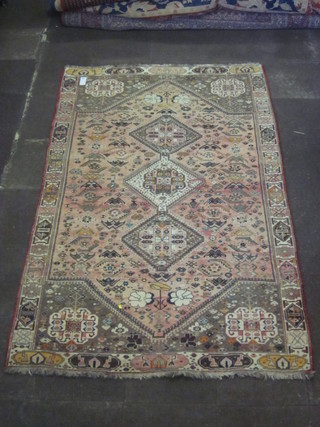 A contemporary pink ground Persian carpet with 3 octagons to  the centre 110" x 69"