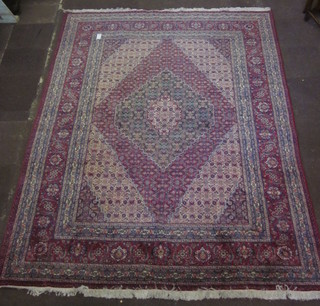 A fine quality contemporary Persian red and green floral ground carpet with diamond shaped lozenge to the centre 132" x 99"