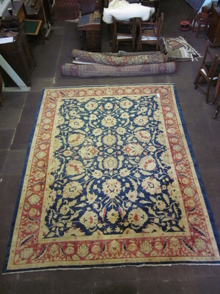 A contemporary blue and cream floral patterned Persian carpet  139" x 108"