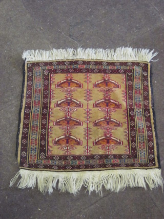 A "Bokhara" cream ground slip rug with 8 octagons to the centre  19" x 21"