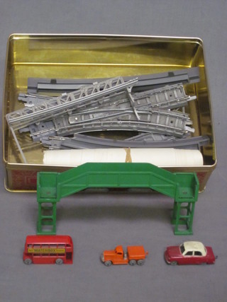 A metal framed railway foot bridge, a Lesney model double  decker bus, do. truck and car etc