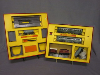 A Triang train set R3.M together with a tender, break van etc  and a Triang Operating Ore Wagon set no. R135, boxed