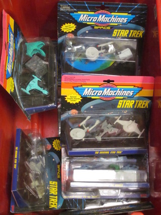 A collection of Star Trek micro machine models