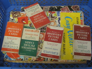 A Stanley Gibbons grey venture stamp album and an All National  stamp album and 5 various Observer Picture card books