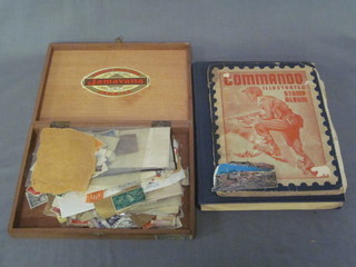 A blue Capital stamp album, a Commando illustrated album and  a cigar box containing stamps