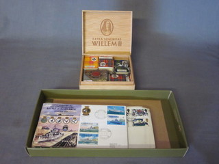 A quantity of various first day covers and a collection of various match boxes decorated Scots clans