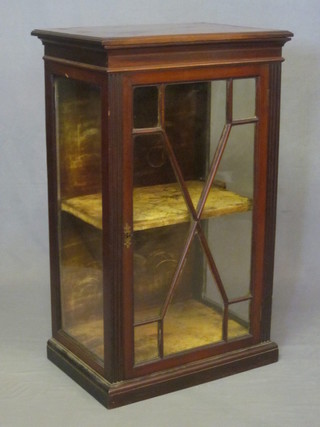A 19th Century mahogany pedestal display cabinet, the interior fitted shelves and enclosed by astragal glazed panelled doors,  raised on a platform base 20"