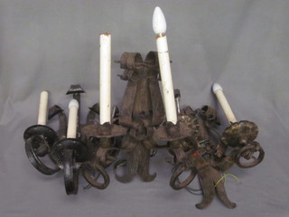 A pair of wrought iron twin light wall brackets and 1 other