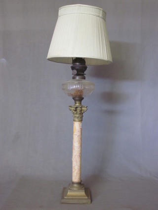 A Victorian glass oil lamp reservoir, cracked, raised on a pink  veined marble and gilt metal column with Corinthian capital 21"