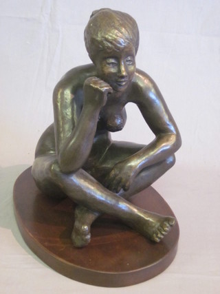 A bronzed figure of a seated naked girl 15"