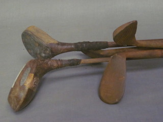 An Auchterlow hickory shafted driver, 1 other driver and 3  hickory shafted golf clubs