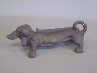 An iron boot scraper in the form of a Dachshund 14"