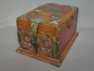 A carved Eastern hardwood and brass mounted box, the hinged lid revealing a mirror, the base fitted 2 short and 2 long drawers  enclosed by carved panelled doors, gilt mounted throughout, 9"