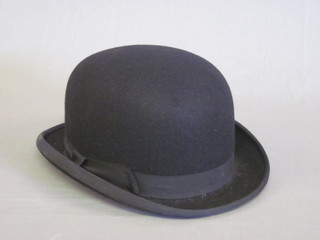 A gentleman's black light weight bowler hat by Dunns, size 7