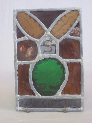 A stained glass panel marked Oak Cottage 8" x 6"