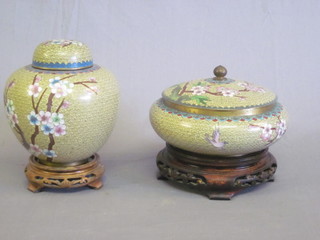 A circular cloisonne jar and cover with floral decoration 6" and a ginger jar and cover 6"