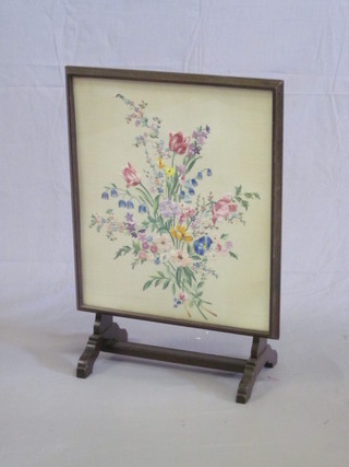 A 1930's firescreen/table with floral tapestry panel 19"