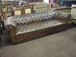 A Chesterfield upholstered in brown leather 98"