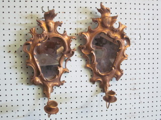 A pair of Rococo style plate mirrors contained in gilt frames with candle sconces 12"