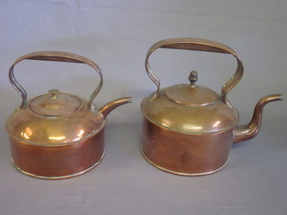 2 circular copper kettles