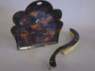 An Oriental style lacquered crumb tray and brush