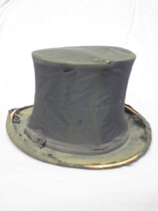 A folding opera hat by Lincoln Bennett, battered,