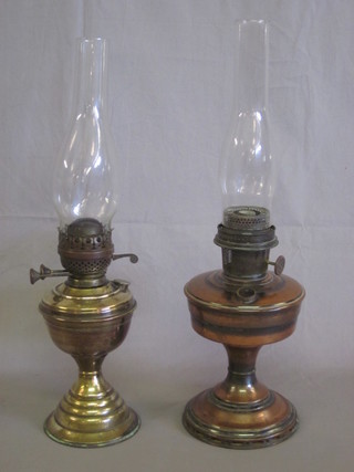 A brass oil lamp and a copper oil lamp