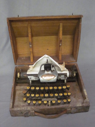 A Blick portable typewriter contained in a wooden case