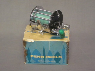 A Penn 67 fishing reel, boxed