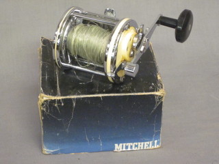 A Mitchell 624 fishing reel, boxed
