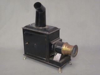 A childs magic lantern contained in a Japanned black metal case  10"