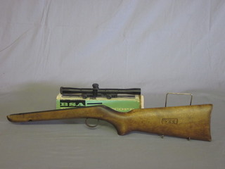A walnut BSA air rifle stock and a BSA telescopic sight