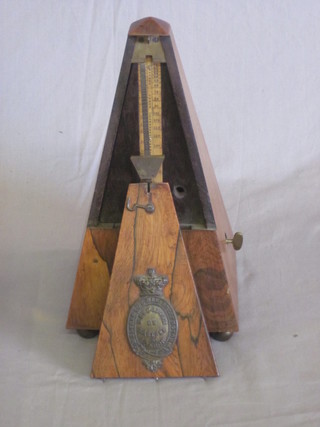 A Victorian metronome by B Cocks & Co contained in a  rosewood obelisk case